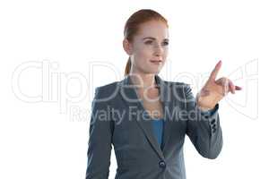 Attractive young businesswoman using imaginary interface