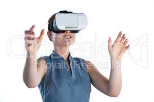 Happy young businesswoman gesturing while wearing virtual reality glasses