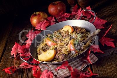 Fried liver with onion apple and herbs.