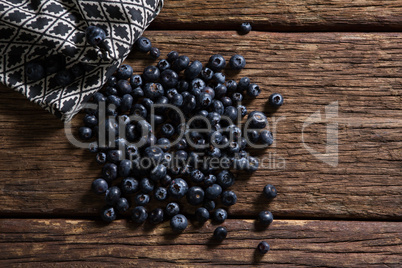 Blueberries and napkin on wooden table