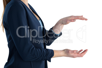 Side view of businesswoman holding imaginary product