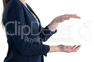Side view of businesswoman holding imaginary product