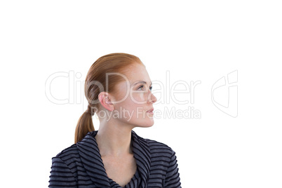 Close up of contemplated young businesswoman looking away