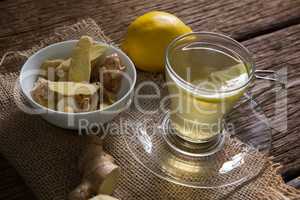Bowl of ginger sliced with lemon tea