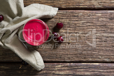 Cherry and juice on wooden table