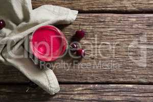 Cherry and juice on wooden table