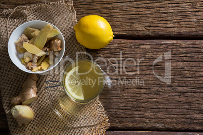 Bowl of ginger sliced with lemon tea