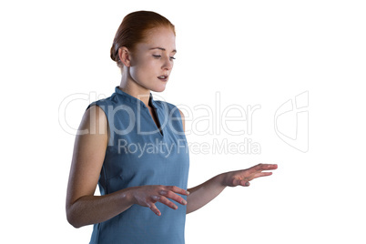 Young businesswoman working on imaginary screen