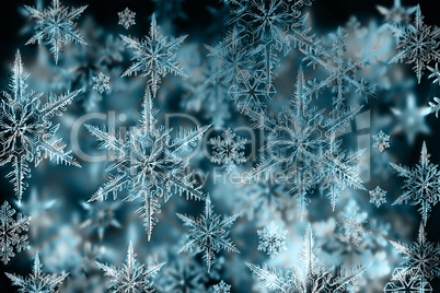 Colorful Christmas background with snowflakes and stars on a blu