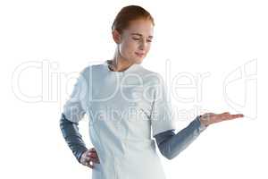 Confident businesswoman holding imaginary product