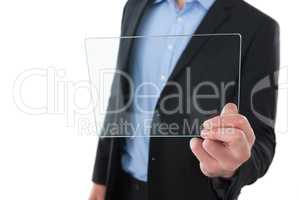 Mid section of businessman holding transparent glass interface