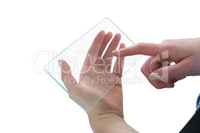 Cropped hand of businesswoman touching glass interface