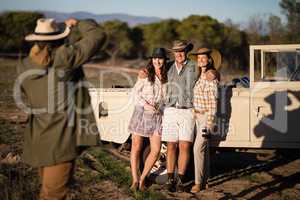 Man taking a picture of his friends during safari vacation