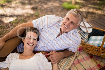 Portrait of happy couple relaxing in cottage