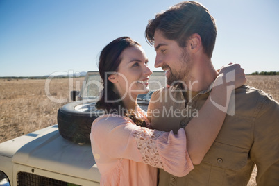 Romantic couple by off road vehicle