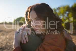 Couple embracing on landscape