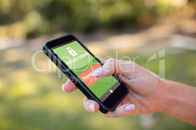 Composite image of internet banking text on green mobile display