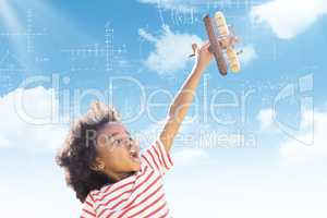 Composite image of child holding wooden airplane