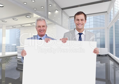 Business men holding blank card in office