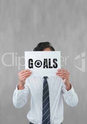Business man holding a card with goals text