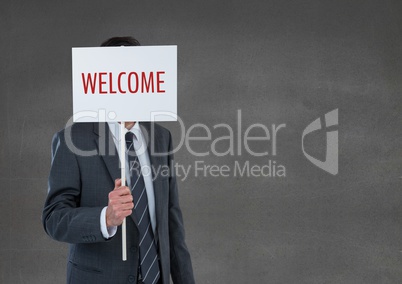Business man holding a card with welcome text