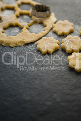 Close up of flower shape pastry cutter on dough