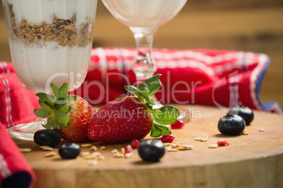 Cup of cereals with fruits and yogurt