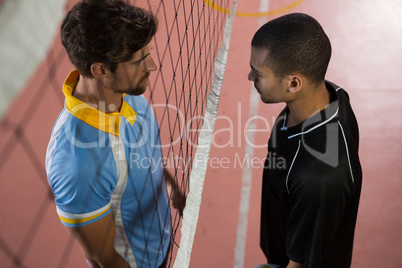 Volleyball players looking each other