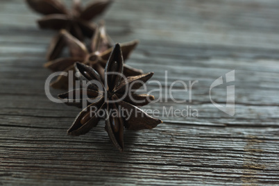 Star anises on wooden table