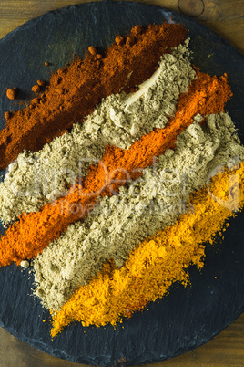 Various type of spice powder on slate plate