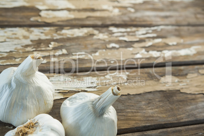 Garlic bulbs on wooden table