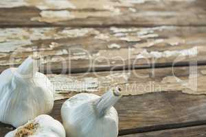 Garlic bulbs on wooden table