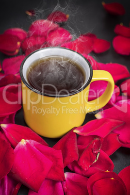 round yellow mug with hot tea