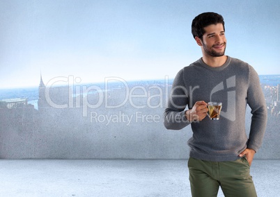 Man holding cup next to smooth city wall