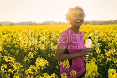 Mixed Race African American Girl Teenager Runner Drinking Water