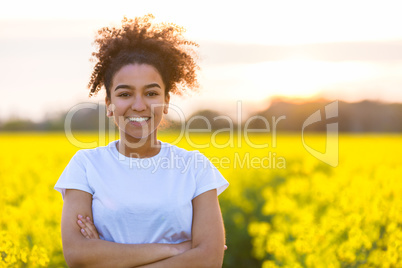 Happy Mixed Race African American Teenager Woman in Yellow Flowe