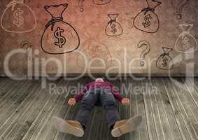 man laying down in front of money on wall