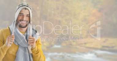 Man in Autumn with hat and scarf in bright forest