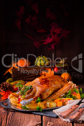 Christmas goose with pumpkin and fruit filling