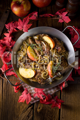 Fried liver with onion apple and herbs.