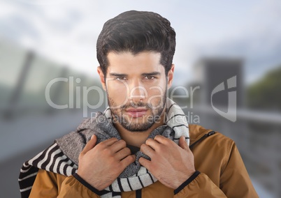Man wearing scarf on bridge