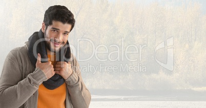 Man in Autumn with scarf in bright forest