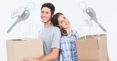 people moving boxes into new home with keys
