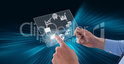 Man pointing at glowing icons while holding futuristic device