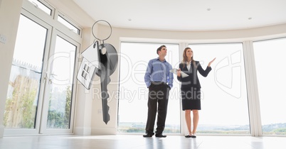 people moving into new home with key