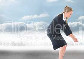 Businesswoman pulling rope over city