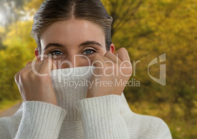 Woman in Autumn with jumper tight in forest