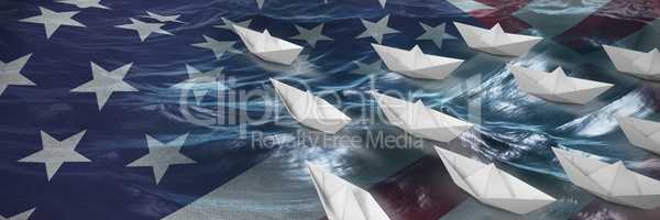 Composite image of high angle view of paper boats arranged