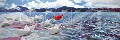 Composite image of paper boats arranged
