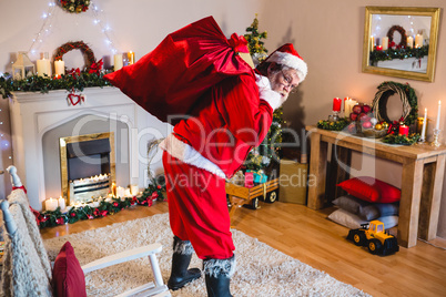 Santa Claus holding christmas bag